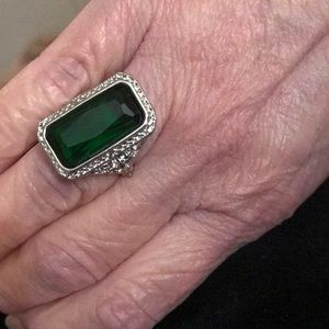 Green colored stone ladies ring.